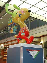 Cammie Sanders, Ms. US Continental 2002, checks out Snoopy at the Mall of America in Minnesota.