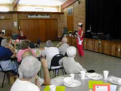 Cammie Sanders, Ms. US Continental 2002, entertains for a luncheon at St. Paul United Methodist.